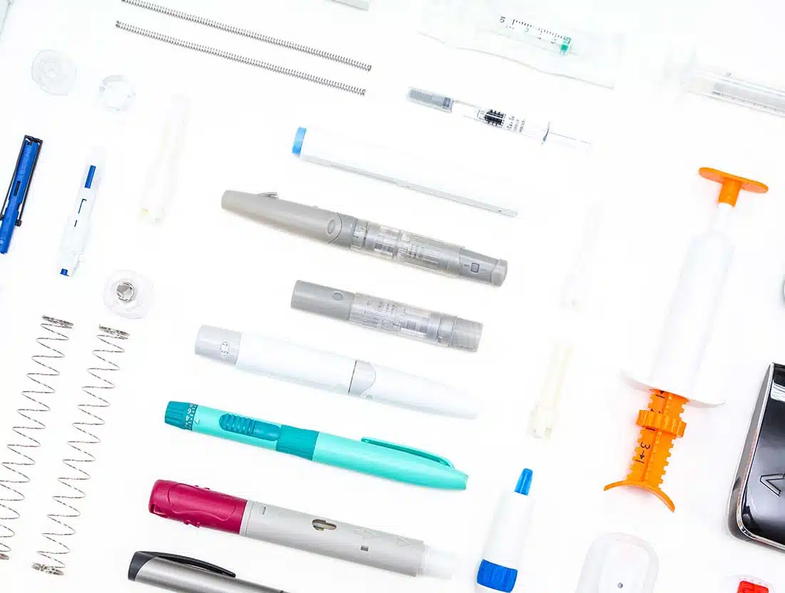 Image showing a selection of medical devices, including autoinjectors and blood glucose meters used in our Medical device designdevelopment services