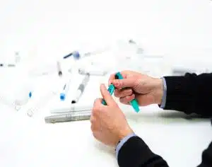 Design engineer reviewing a 3D printed medical prototype