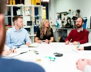 A team of design engineers and medical device development consultants discussing medical device projects at a UK design consultancy