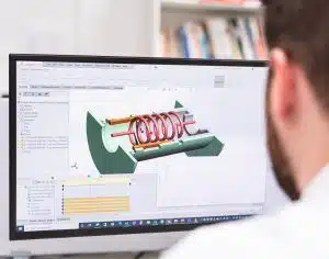 Design engineer using CAD and FEA to improve an inhalation medical device design robustness with sensitivity analysis