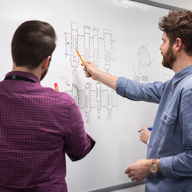 Group of medical device design engineers brainstorming medical device concepts at a design consultancy