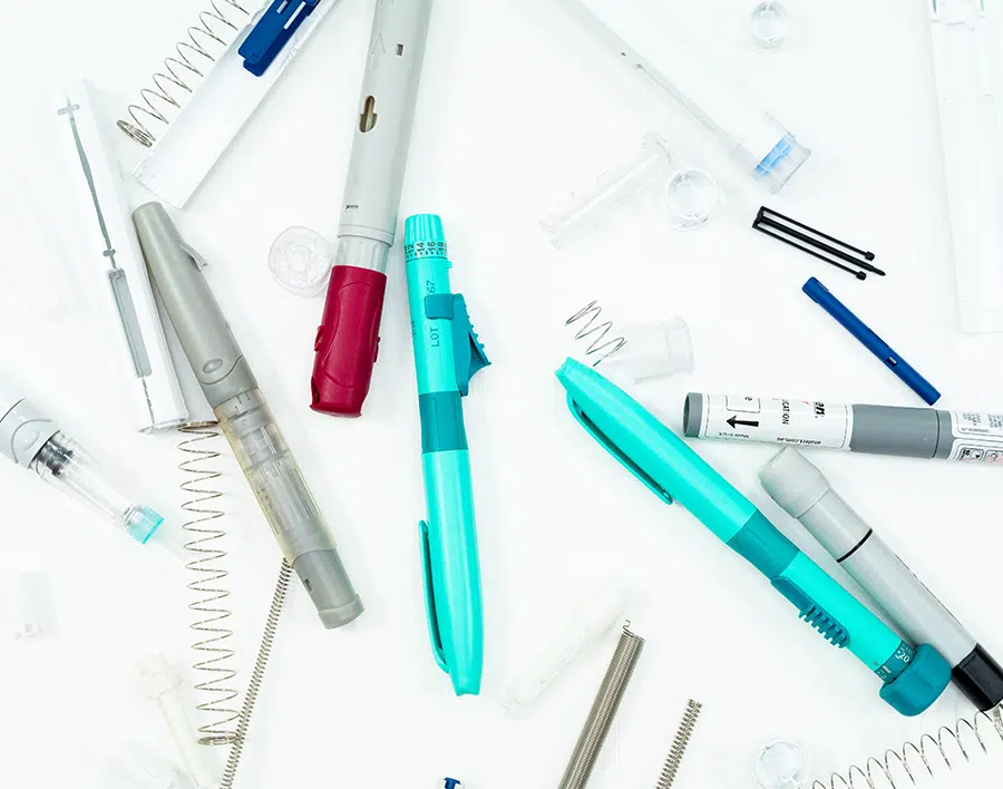 Image showing autoinjector and combination device components - medical device development services